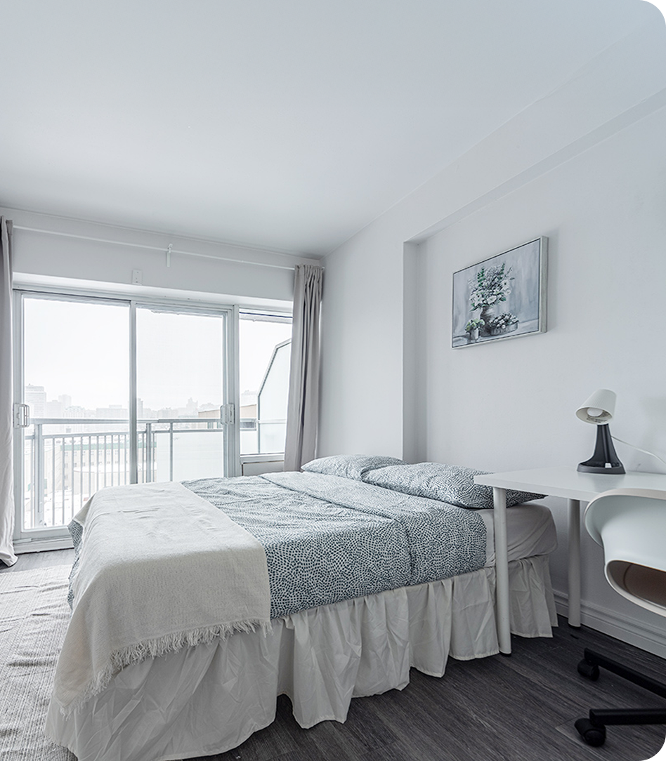 Bright furnished bedroom with balcony